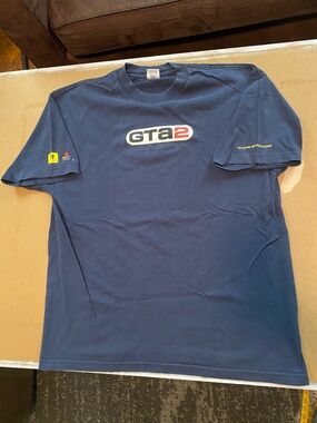 GRAND THEFT AUTO 2- TeeBoth sleeves have prints.Art shows wear/cracks.